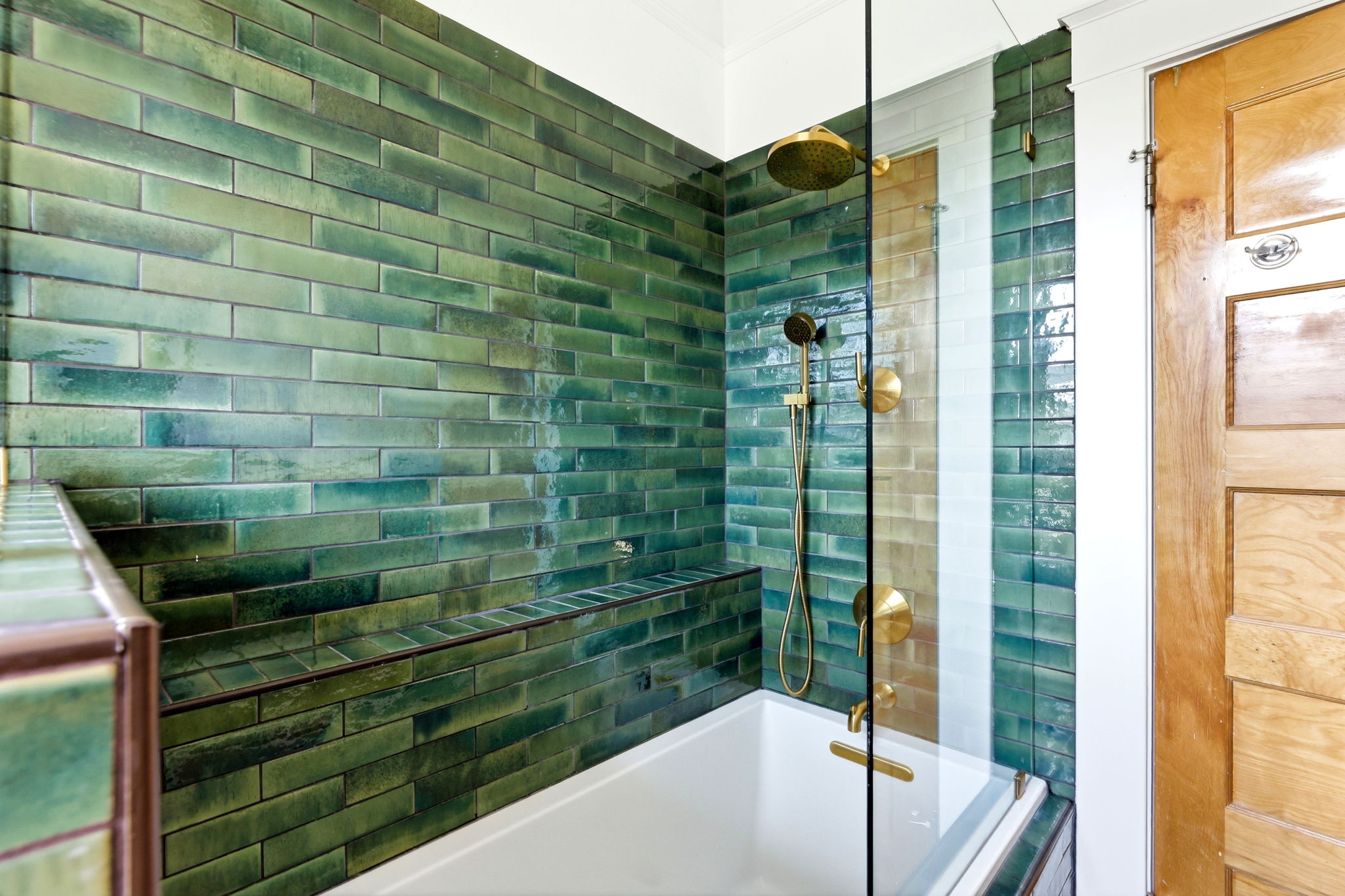 Remodeled bathroom with soaking tub and tile surround, view 2
