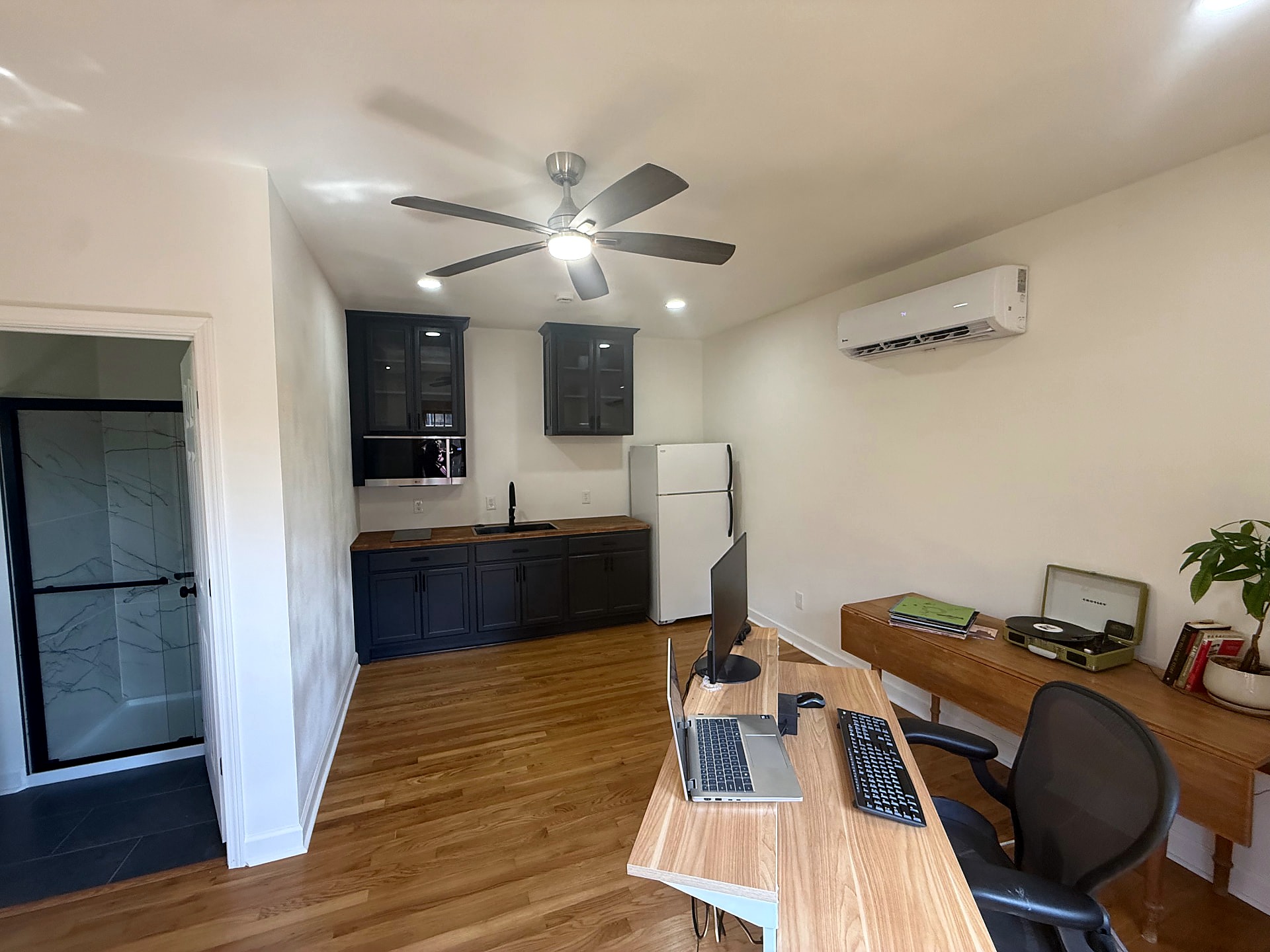 Newly completed carriage-house studio with oak floors and kitchenette