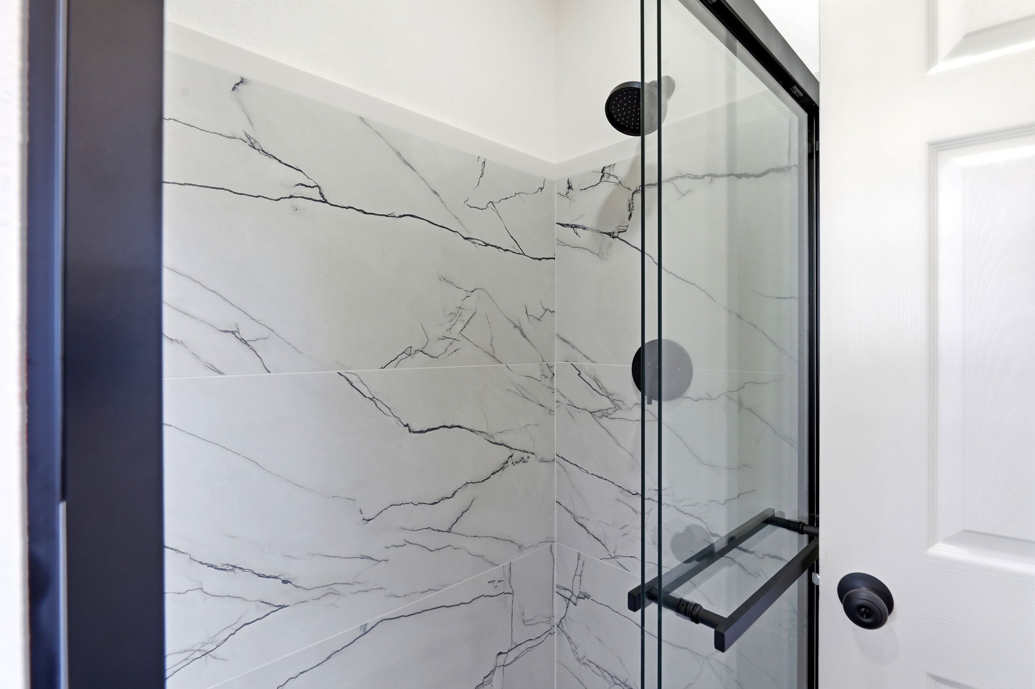 Carriage-house studio bathroom with large-format tile shower