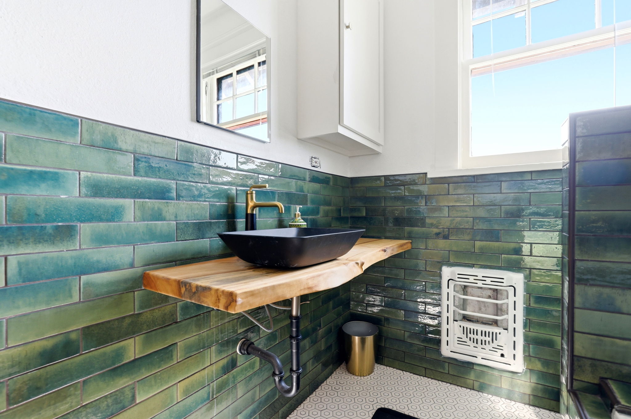 Remodeled bathroom with soaking tub and tile surround, view 3